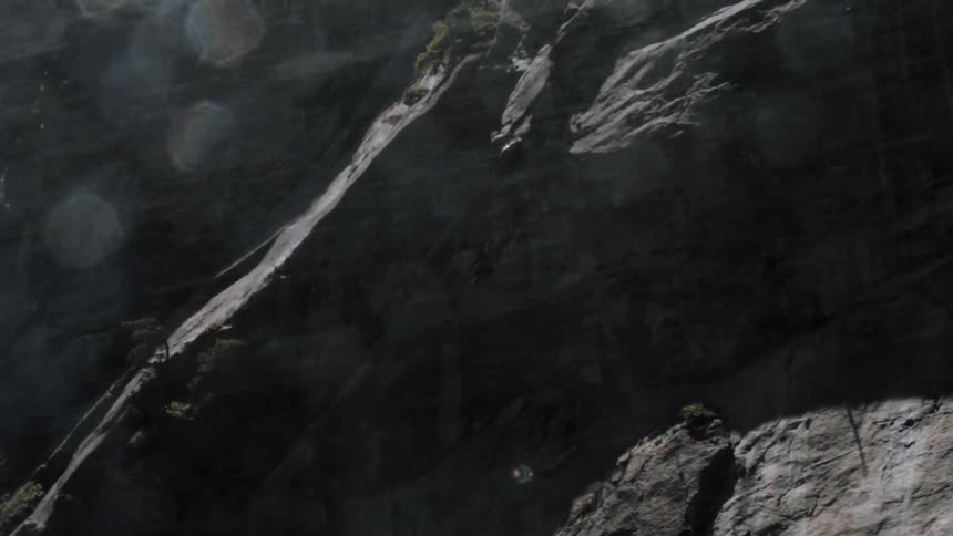 View of some rocks on a cliff with heavy shadows
