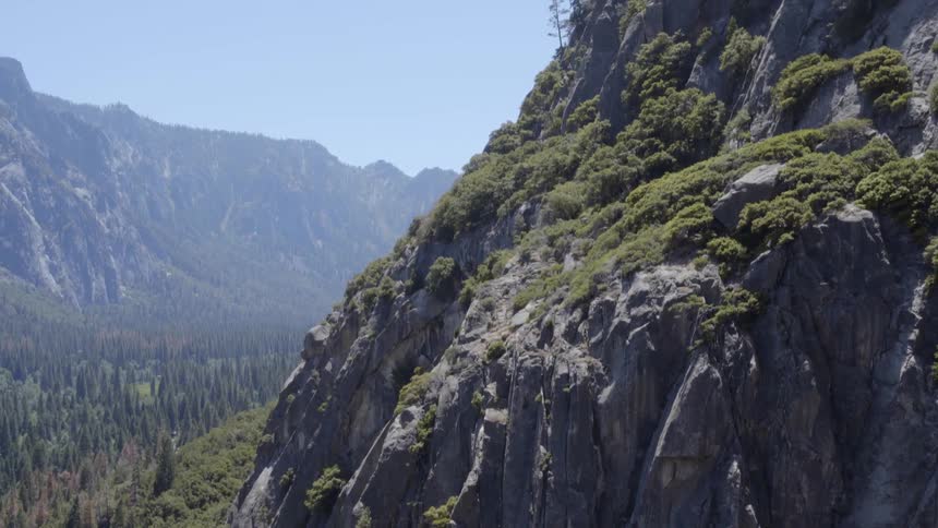 View of the side of a mountain covered with grass
