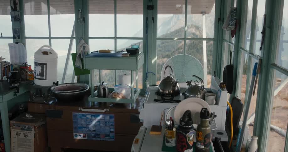 A kitchen is facing a mountain range