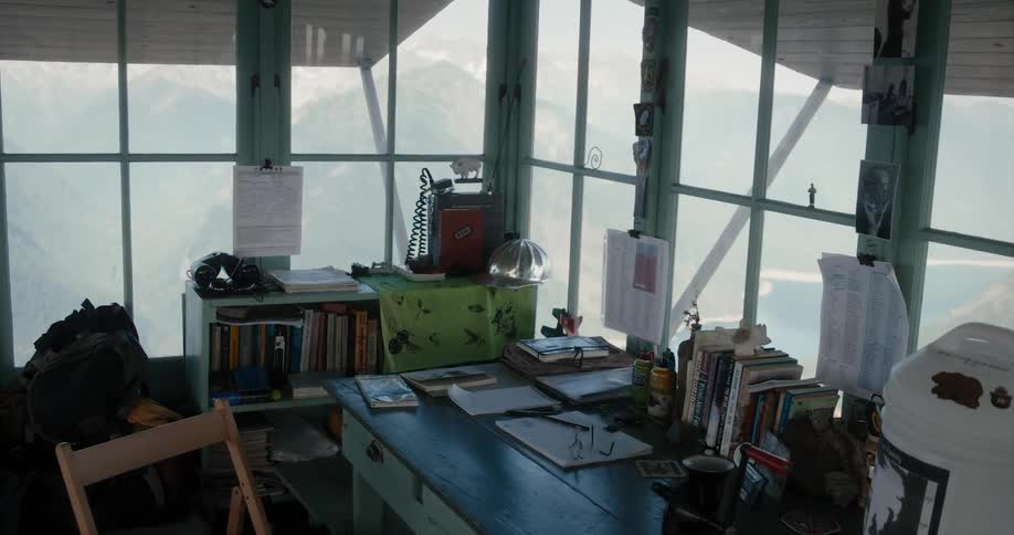 The office desk is full of books