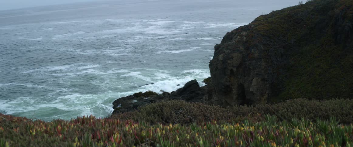 A view of waves crashing against a shore