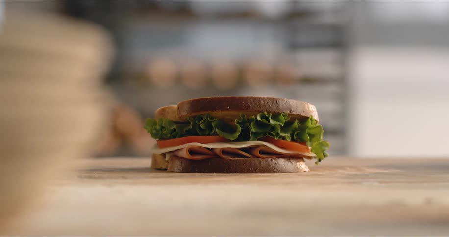 A bacon lettuce and tomato sandwich on table