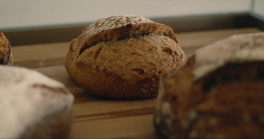 Baked bread is laid out on the table