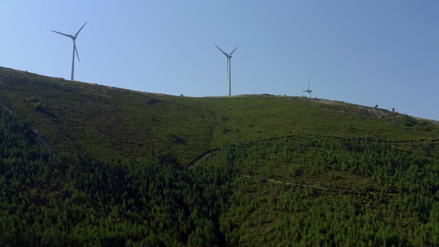 Wind turbines spinning on a wind farm