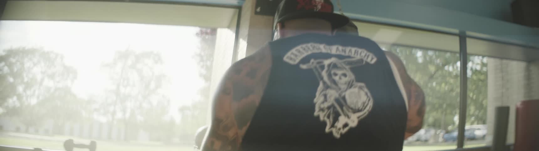 A man is punching a heavy bag in a gym