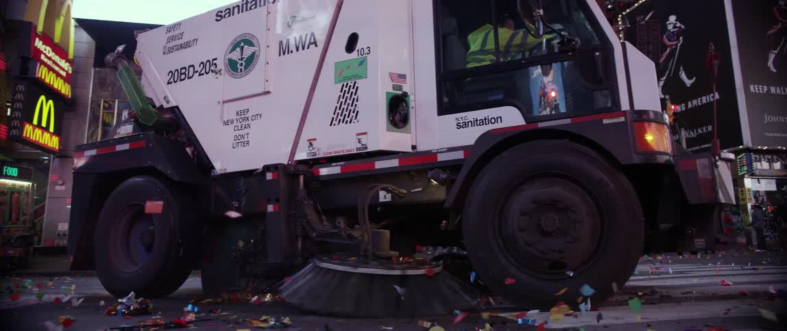 A street sweeper cleans this city street