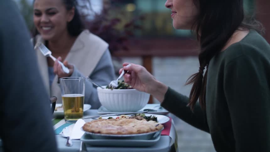 Two women eating outdoors