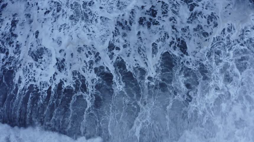 A beach with water and waves