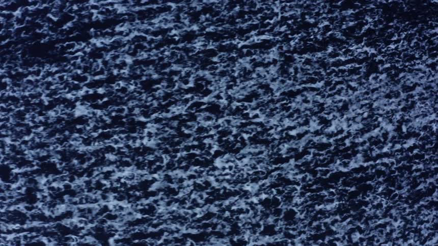 Water rushes as foam rises to the top