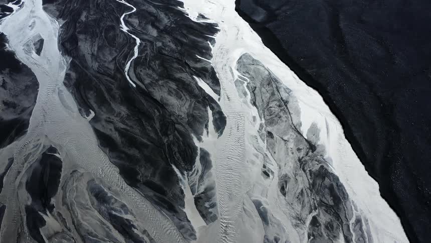 Aerial view of a river flowing on a volcanic landscape
