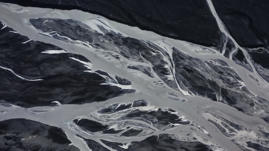 Aerial view of frozen rivers on a volcanic landscape