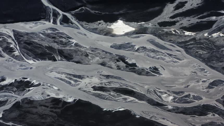 Aerial view of a complex river system on a volcanic landscape