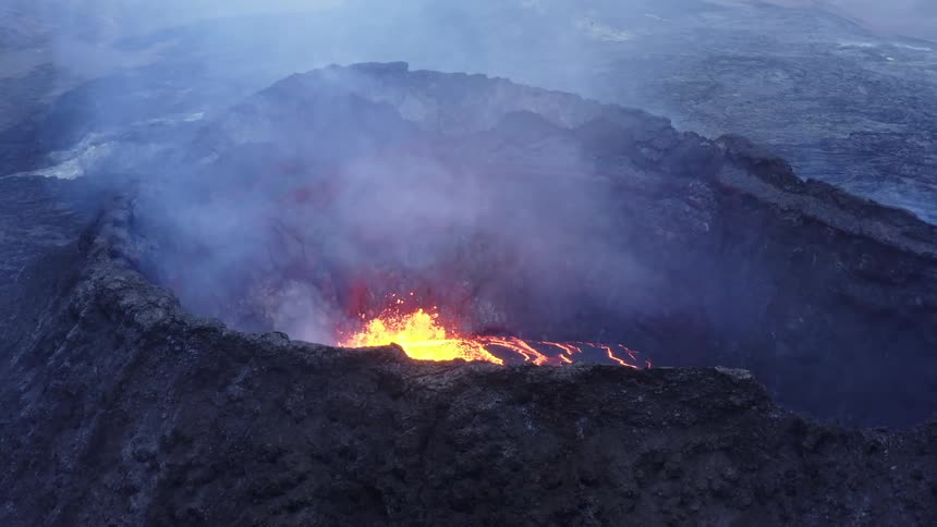 Smoke rises from active volcano as magma bursts into air