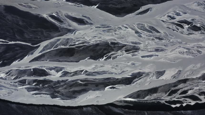 Aerial view of frozen rivers on a volcanic landscape