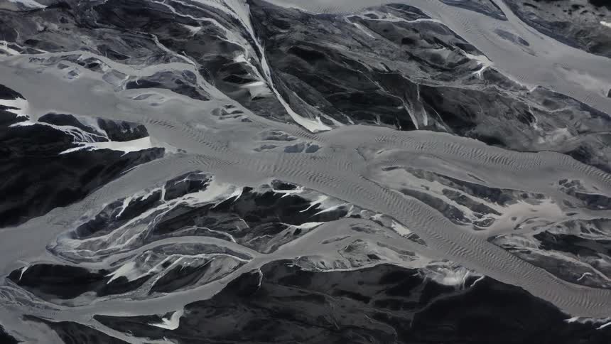 Aerial view of frozen streams and rough terrain