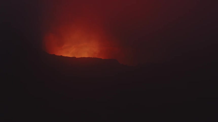 A volcano with molten lava and smoke