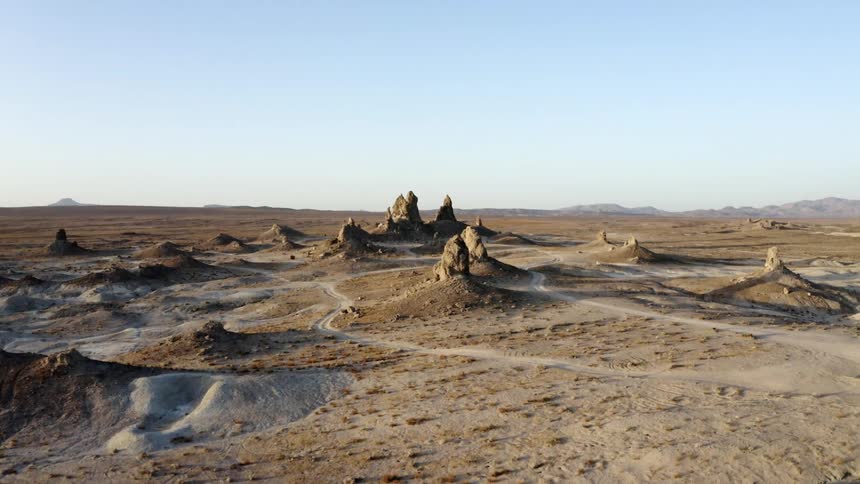 Pointed rock formations dot the landscape in a canyon