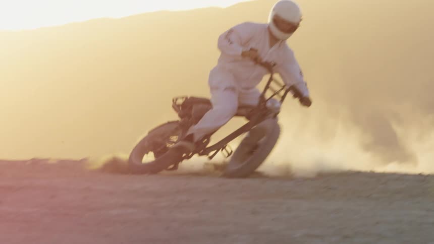 A man riding a dirt bike outdoors