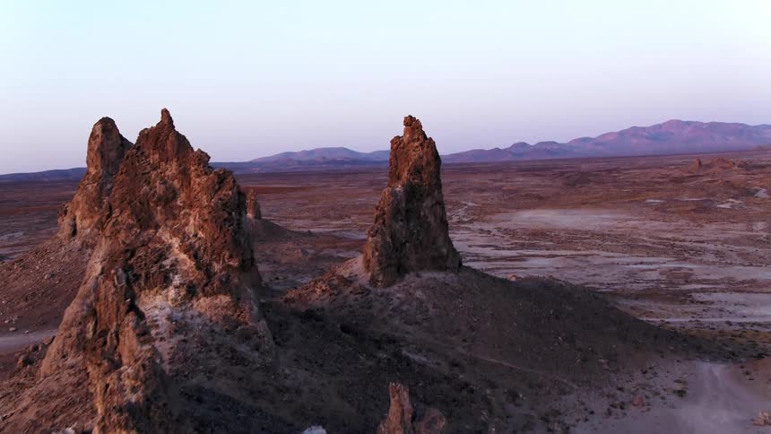 Large rock crags sticking up out of the ground in desert wilderness