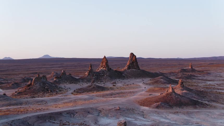 An aerial view of the desert with rocks and hills