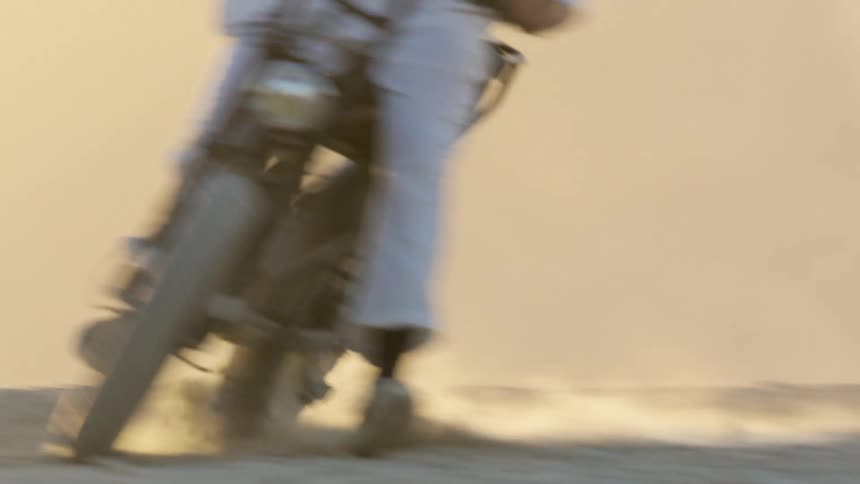 A person riding a dirtbike around