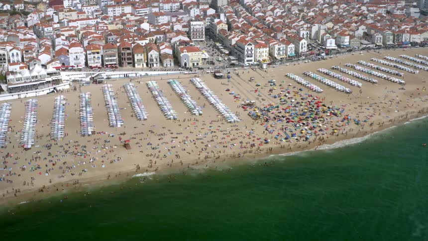 Hundreds of people relax on the beach