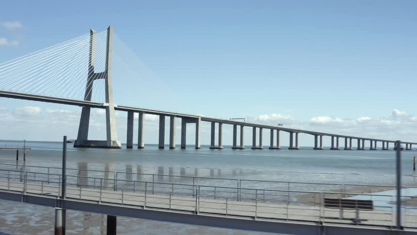 An aerial view of a bridge over the ocean