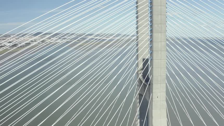 An aerial view of a bridge over the ocean