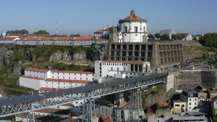 Aerial view of a pedestrian overpass near a fort on a small town