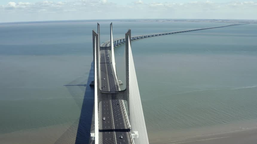 An aerial view of a bridge over the ocean