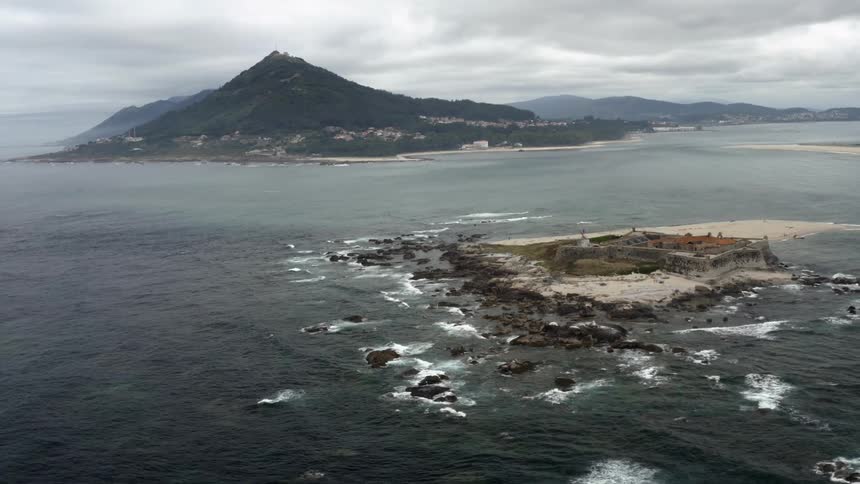 A fort sits on a small isolated island in the ocean