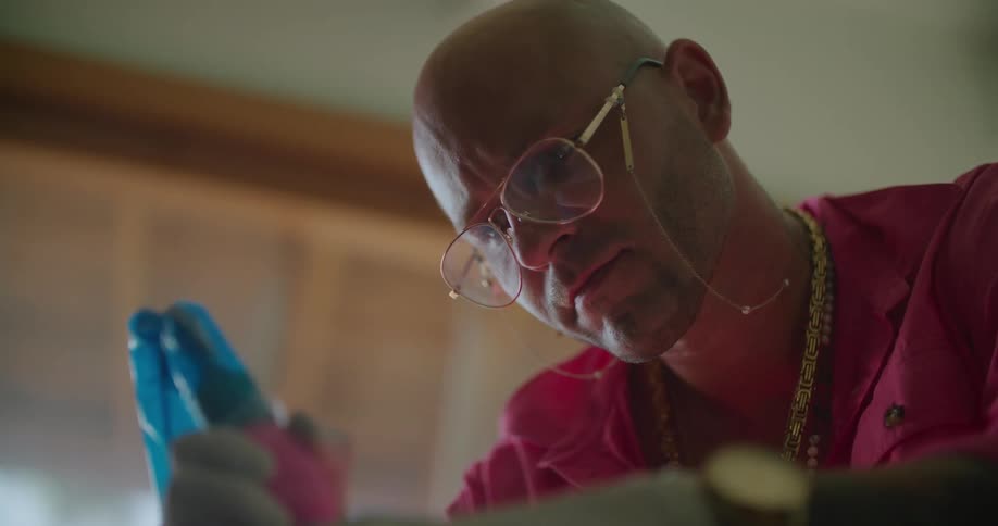 A man using a tattoo gun on a person