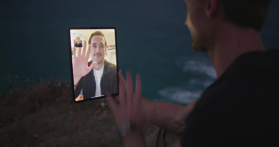 Two men are talking on a video call on a tablet