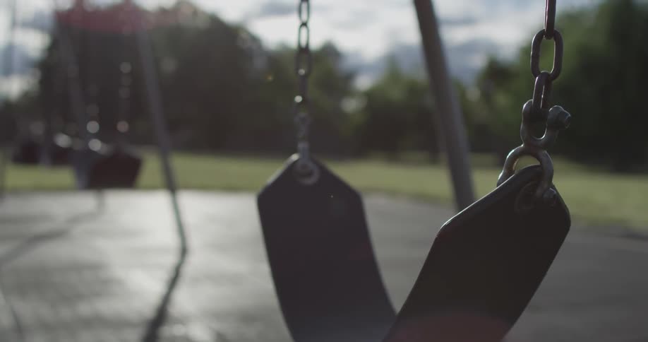 An empty park has still swings