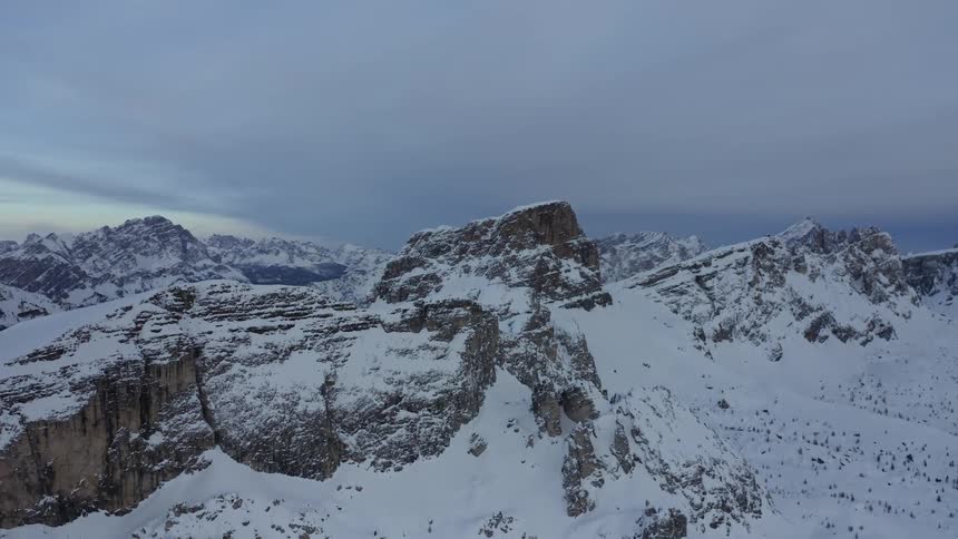 Snow covers peaks of a mountain range