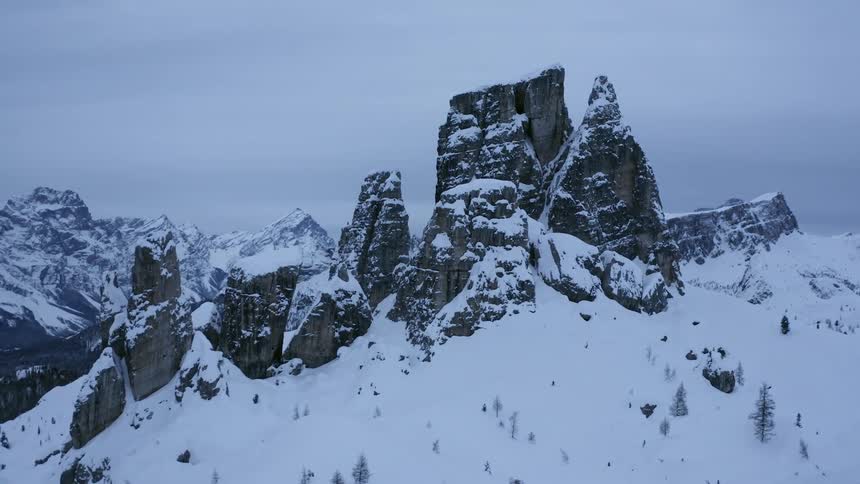 Aerial view of rock promontories covered in snow in the mountains