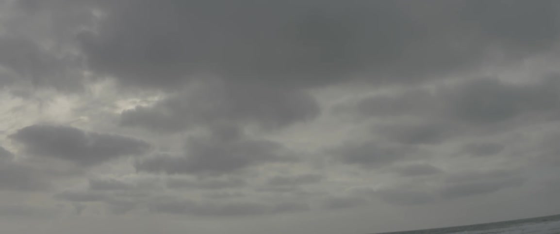 Heavy clouds are above this beach