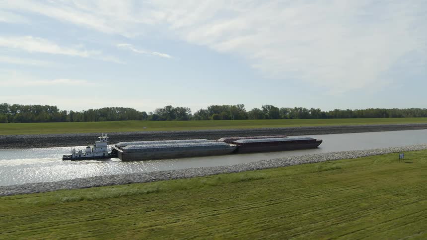 Low orbit around a cargo barge traveling along a canal