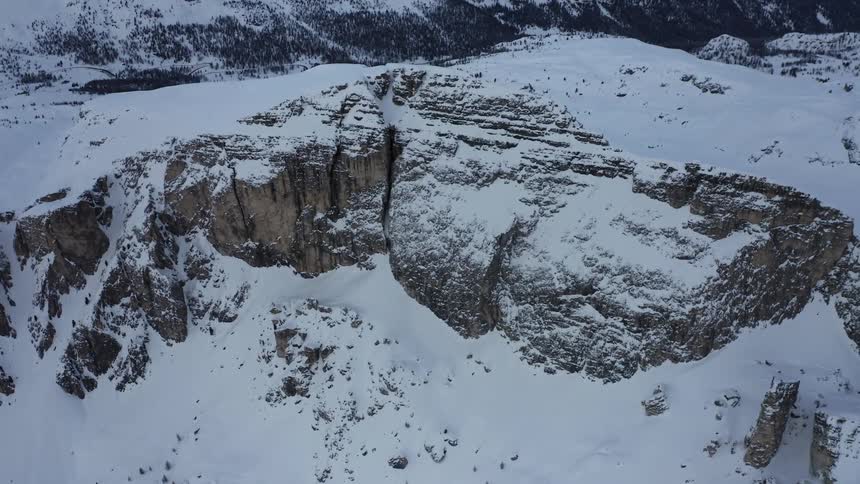 Snow covered rock cliffs in the mountain wilderness