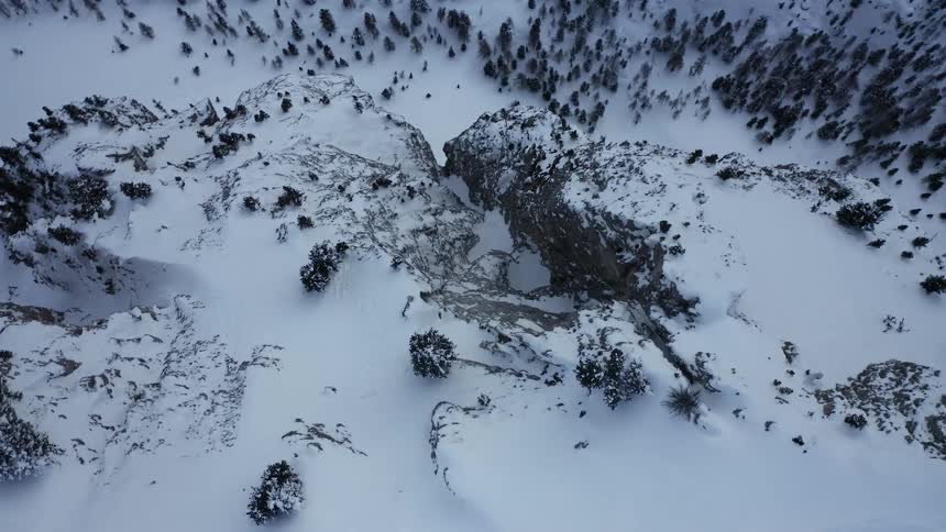 Snow covered rock cliffs and mountains in the wilderness
