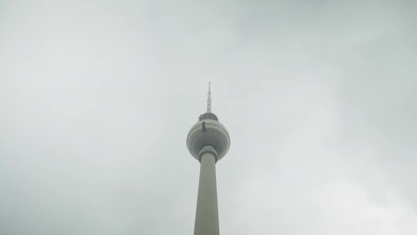 Berlin tv tower restaurant under the gray clouds at daytime