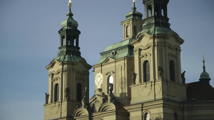 An old church building with several statues included in the architecture