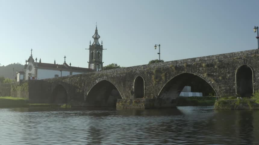 View of old bridge and church seen from river