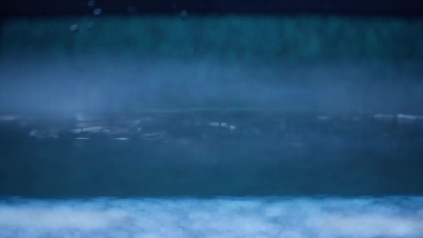 Water running with ripples and bubbles