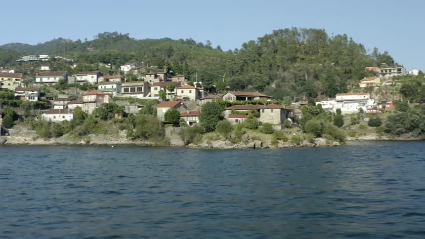Homes line the water of the river