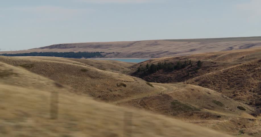 Traveling past rolling dry hills in the country