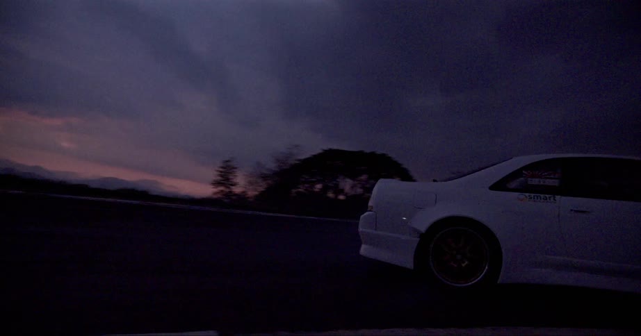 A driver loses control and starts drifting on a race track