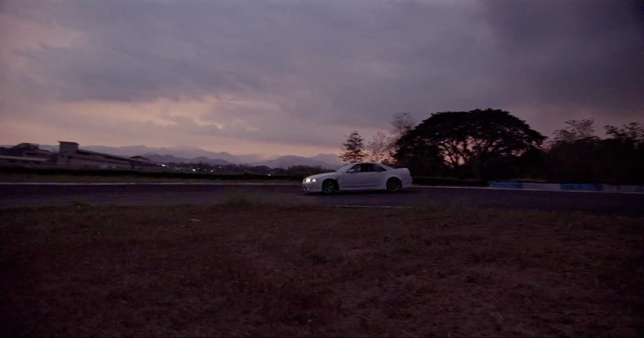 A white car turns on the runway