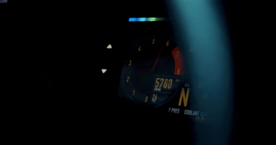 A speedometer in a vehicle at night
