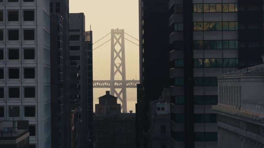 High rise city buildings and bridge at dusk